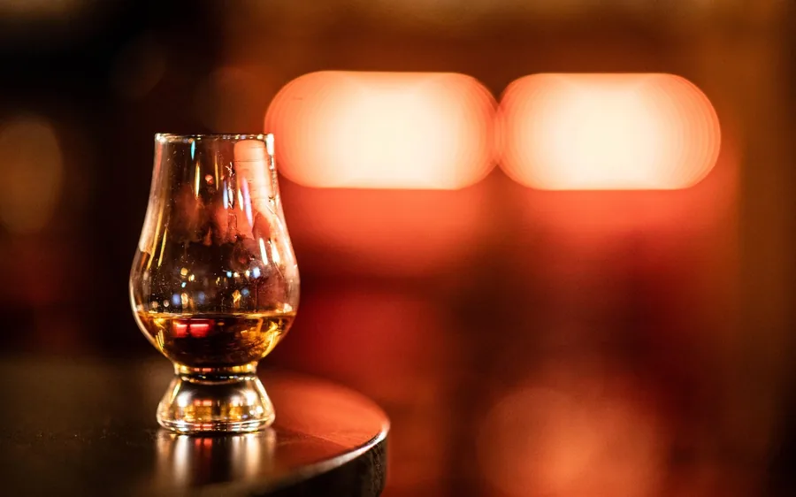 A row of nosing glasses set for a tasting on the Royal Mile